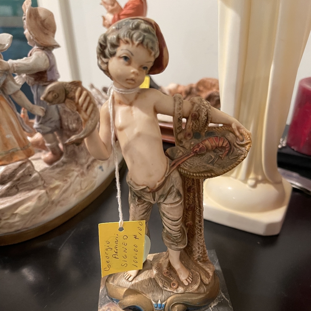 Giorgio Armani Figurine with Red and Brown Accents